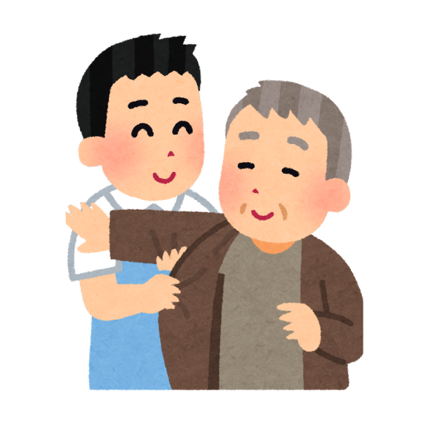 介護を受けるお年寄りと介護職員。
お年寄りに服を着せてあげようとしている。