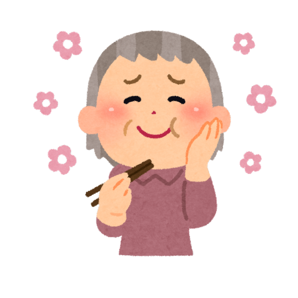 介護施設を選ぶ際の大事なポイントの一つとして、食事がある。美味しいものを頬張って幸せそうに微笑むおばあちゃんのイメージ画像

