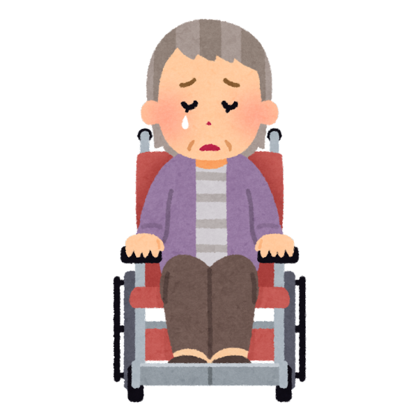 待機老人のイメージの車椅子に不安そうに座るおばあちゃんの画像