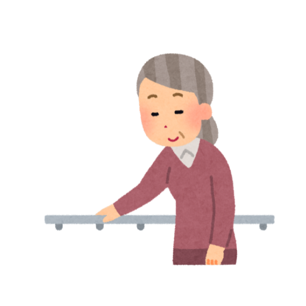 介護施設で手すりに捕まりながら歩く老婆のイメージ画像