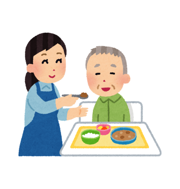 家族が高齢者に介護食を食べさせてあげている画像